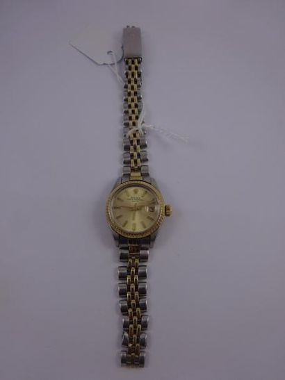 ROLEX, Oyster perpetual date' 

Montre bracelet de dame en or jaune (750) et acier.

Cadran...