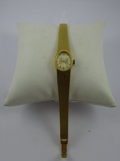 EVIANA Montre bracelet de dame en or jaune (750). Boîtier ovale. 

Cadran signé à...