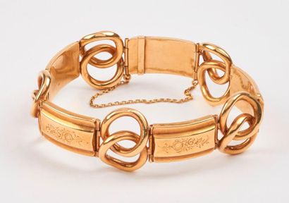 null Bracelet articulé en or jaune (750) creux à maillons rectangulaires gravés et...