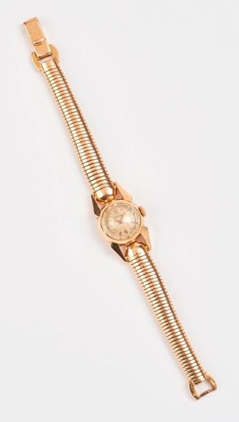 LONGINES 

Montre bracelet de dame en or jaune (750).

Boîtier rond, verre facetté....