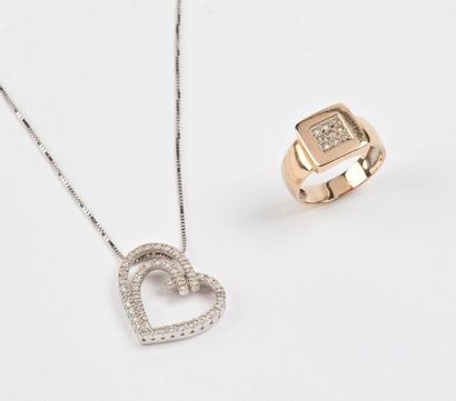 null Pendentif en or gris (750) en forme de coeur évidé serti de petits diamants...
