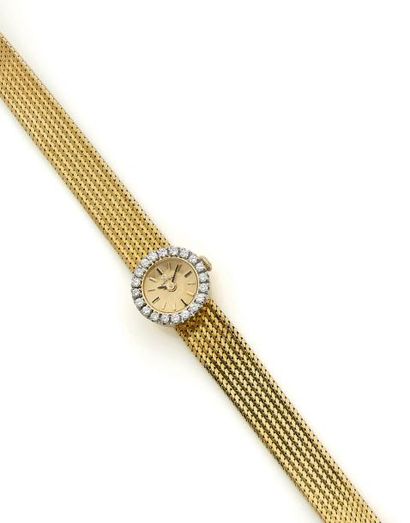 OMEGA Montre bracelet de dame en or 750 millièmes, cadran doré avec index bâtons...