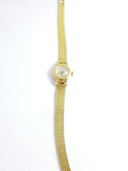 null 
ZENITH


Montre bracelet de dame en or jaune (750).


Boîtier rond.


Cadran...