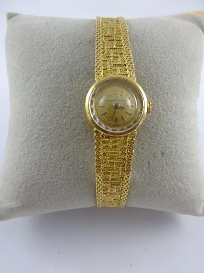 ETERNA 

Montre bracelet de dame en or jaune (750).

Boîtier circulaire.

Cadran...