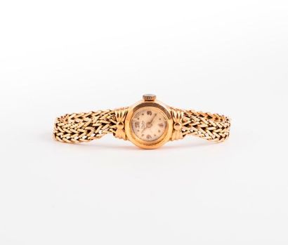 THISY 

Montre bracelet de dame en or jaune (750) 

Boîtier circulaire, lunette agrémentée...