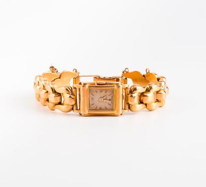 null Montre bracelet de dame en or jaune (750) 

Lunette godronnée, cadran à fond...