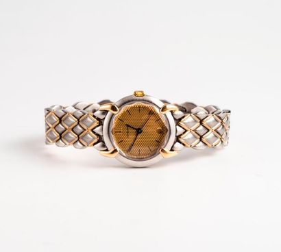 CHAUMET, Griffe 

Montre bracelet de dame en acier et or jaune (585) 

Boîtier circulaire....