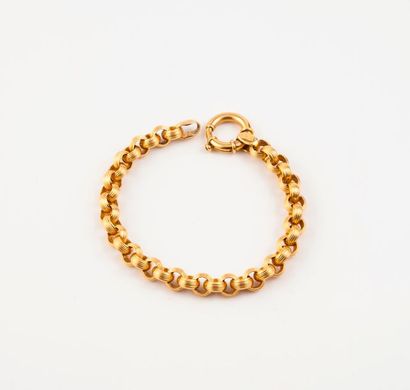 null Bracelet articulé en or jaune (750) à maillons ronds striés. 

Fermoir anneau...