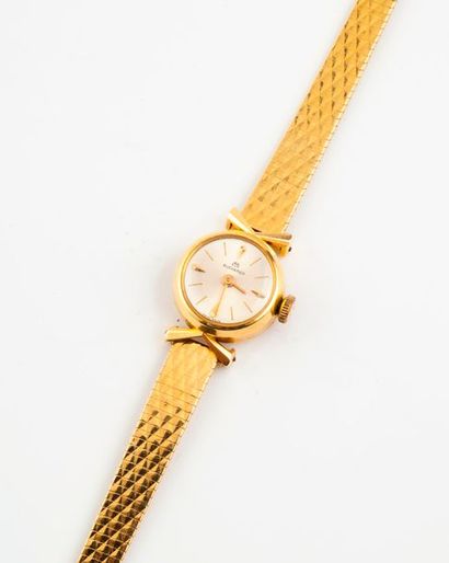 BUCHERER 

Montre bracelet de dame en or jaune (750). 

Boîtier rond. 

Cadran à...