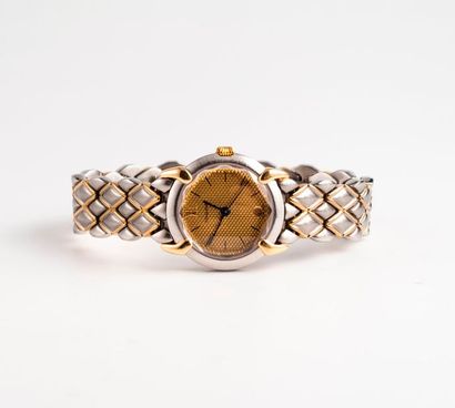 CHAUMET, Griffe Montre bracelet de dame en acier et or jaune (585). Boîtier circulaire....
