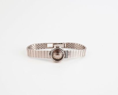 UNIVERSAL GENEVE 

Montre bracelet de dame en or gris (750).

Boîtier rond, lunette...