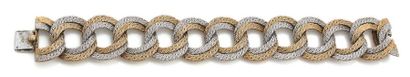 null Bracelet articulé en or gris et jaune (750) formé de maillons ronds ajourés...