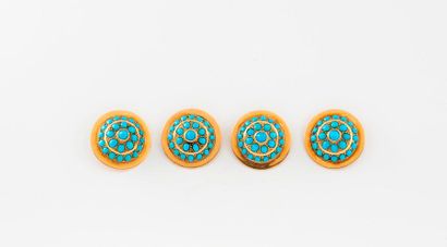 null Quatre boutons circulaires en or jaune (750) ornés de cabochons de turquoises...