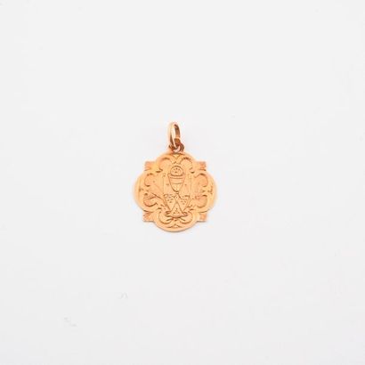 Médaille en or rose (750) chiffrée et datée...