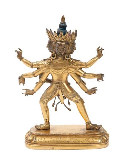 TIBET - XVIIIème siècle Statuette en bronze doré de Yidam à quatre têtes et huit...