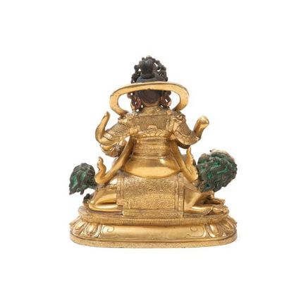 TIBET - XVIIIème siècle Statuette en bronze doré de jambhala assis en sukhasana sur...