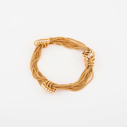 null Bracelet articulé en or jaune (750) à 10 rangs de chaîne à maille palmier orné...