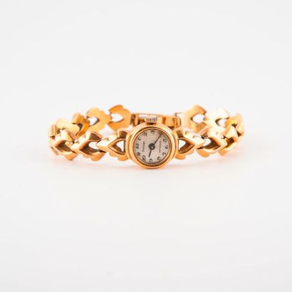 FRESARD 

Montre bracelet de dame en or jaune (750).

Boîtier rond. 

Cadran à fond...