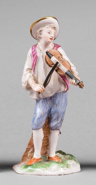 NIDERVILLER 
Statuette en faïence représentant un jeune homme jouant du violon, décor...