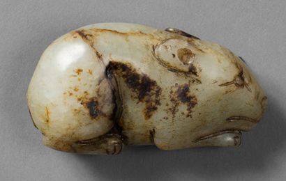 CHINE - XXe siècle 
Two animals made of celadon and rust nephrite: fish holding a...