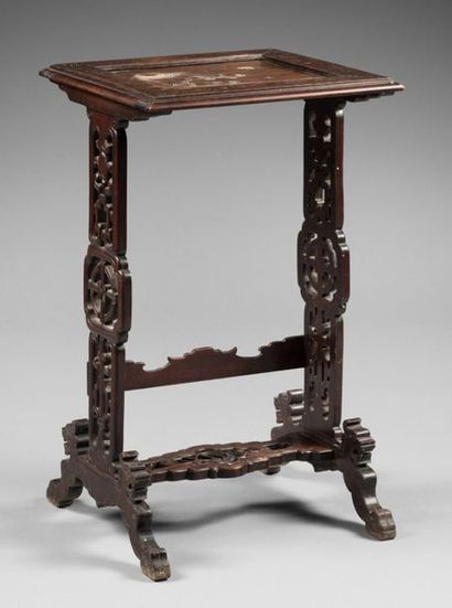 null TABLE GIGON in carved wood, the top inlaid with a lunar landscape.
In the taste...