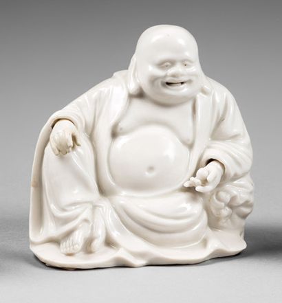 CHINE - XVIIIe siècle 
Statuette of Budai in white enamelled porcelain of China,...