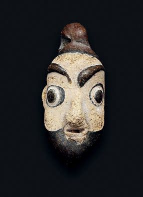 null 
Pendant on core representing a bearded man's face. Multicolored glass on a...