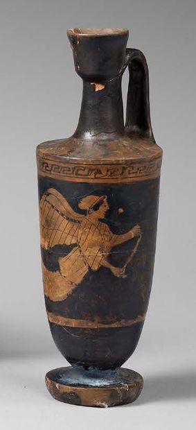 null Red-figured lekythos, the body of which is decorated with a
Niké in flight holding...
