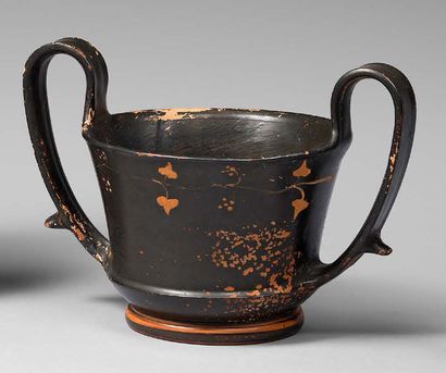 null Black-glazed canthara without a stem, the concave sides of which are decorated...