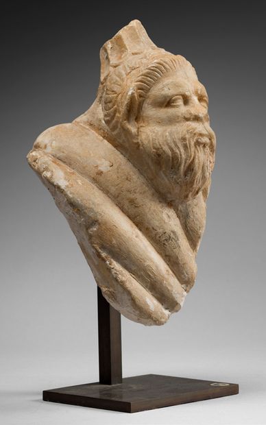 null Fragment of a monumental vase with a handle showing a satyr's head.
White marble....