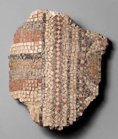 null *Rounded mosaic fragment with geometric decoration.
Multicoloured calcite and...