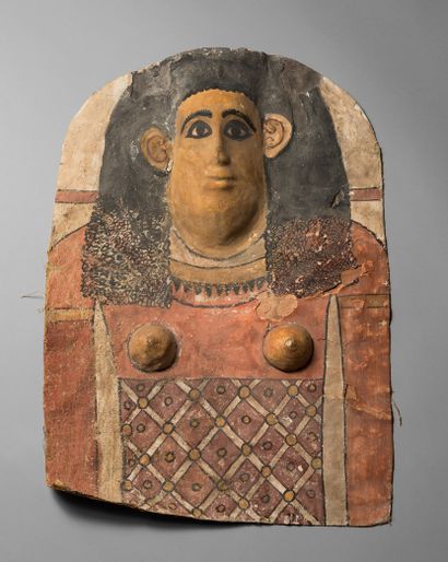 null 9. Mummy breastplate representing the bust of a woman with prominent breasts.
Linen...