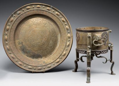 null 
Large circular tray and brazier in copper and bronze, the tray chiselled with...