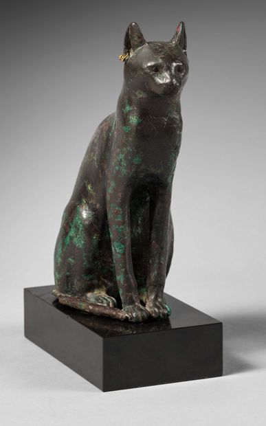 null Statuette representing the cat goddess Bas_x0002_tet sitting on her hindquarters....
