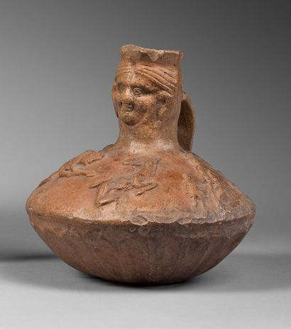 null Enochoé with a double-conical body decorated in relief with hunting scenes and...