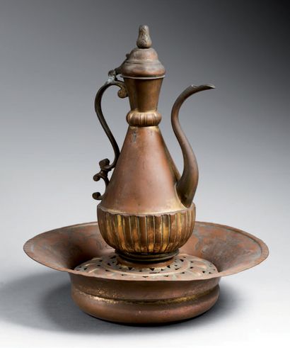 null 
Ewer with its basin and gilded copper soap dish (tombak).



The ewer has a...