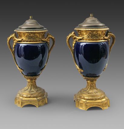 null Pair of large blue ceramic vases and their ormolu mount, the neck with a frieze...
