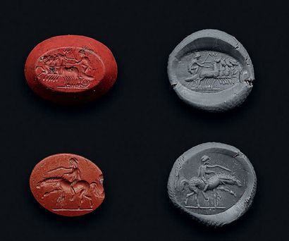 null Set of two intaglios engraved with a quadriga on the left and a rider. Red jasper....