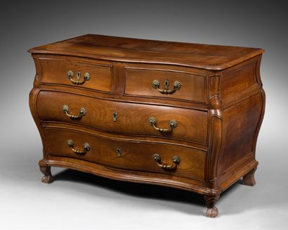 null A cherry wood chest of drawers, opening with four drawers in three rows. The...