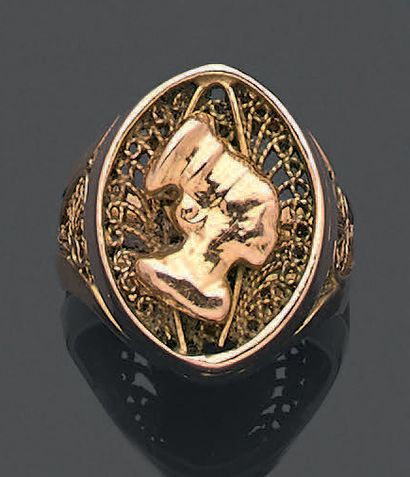 null 
Ring in yellow gold 585 thousandths partially openwork decorated with an African...