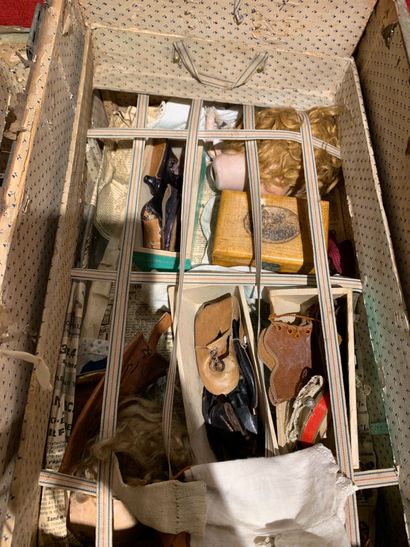 null Box containing doll clothes, shoes, hats, brushes, doll parts.