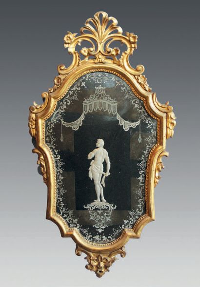null A pair of giltwood mirrors with openwork palmette and foliage decoration, the...
