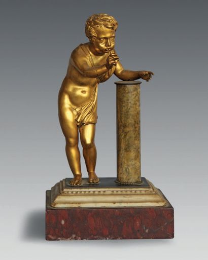 null An ormolu figure of a child blowing soap bubbles (missing) on a white and cherry...