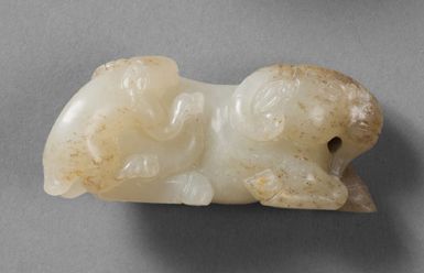 CHINE-style Ming Small celadon and rust nephrite group, a ram lying down, its young...
