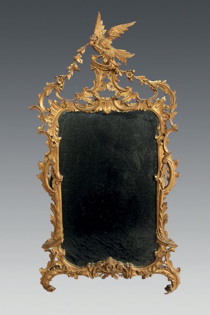 null Gilded wood mirror with asymmetrical openwork decoration of rocaille, foliage,...
