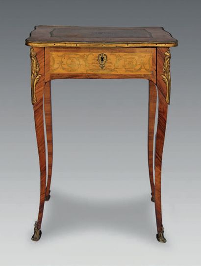 null A stained wood and rosewood marquetry table opening to a drawer and resting...