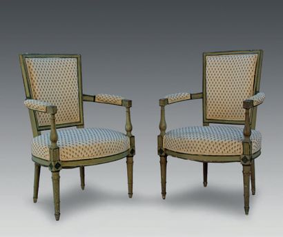 null Pair of repainted wooden armchairs with curved backs, resting on tapered and...