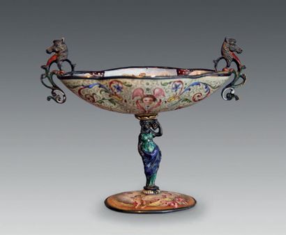 null A painted enamel bowl with grotesque decoration of foliage, mascarons and mythological...