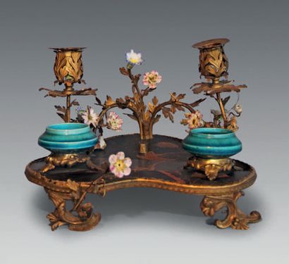 null A Parisian varnish, gilt bronze and porcelain inkwell, with two rocaille light...