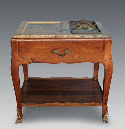 null A fruitwood refreshment table, the marble top with varnished brass compartments,...